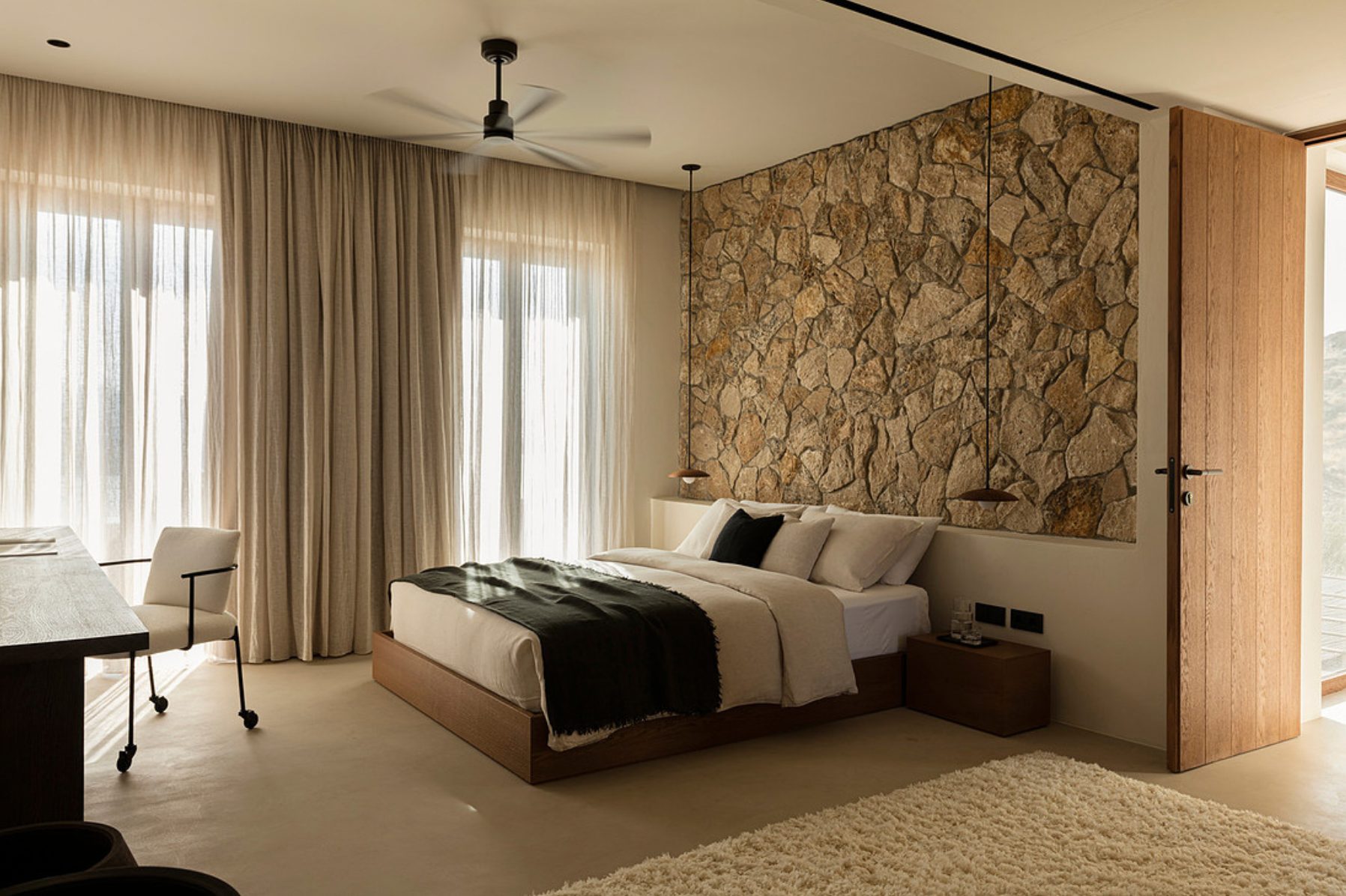 Bedroom with stone feature wall