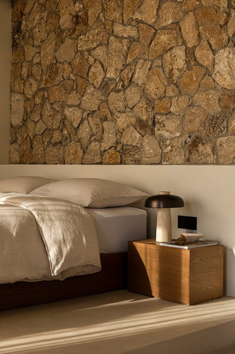 Second bedroom with stone wall