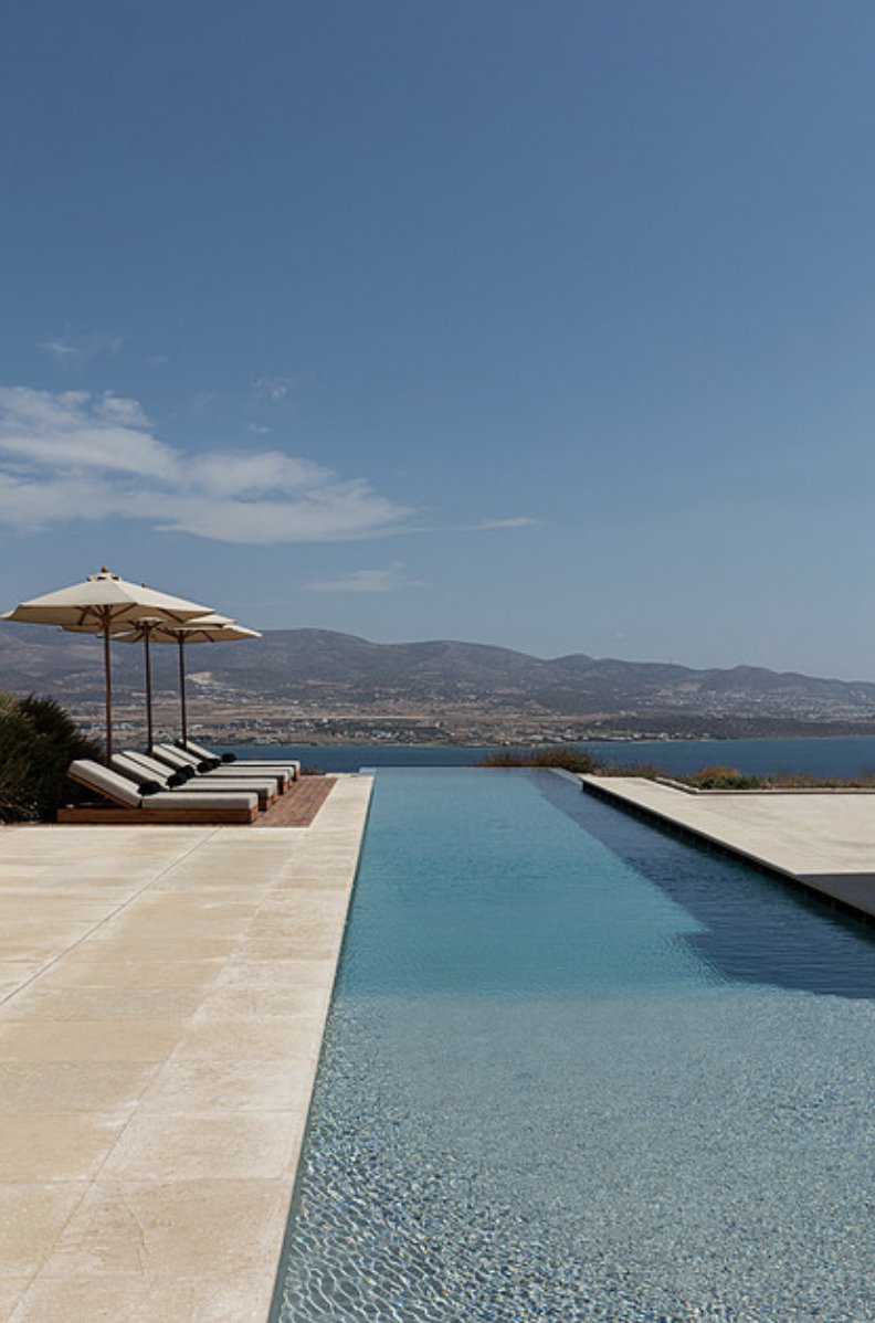 Infinity pool with sea and mountain view